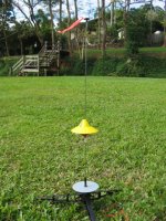 18mm scratch built saucer. Made from an old brochure cover. Upscale and slight modification of Art Applewhite's free 13mm Delta Saucer plans. I added the cone at the top to hide the top of the motor. Design and build time was approx two hours while watching TV and using white glue.